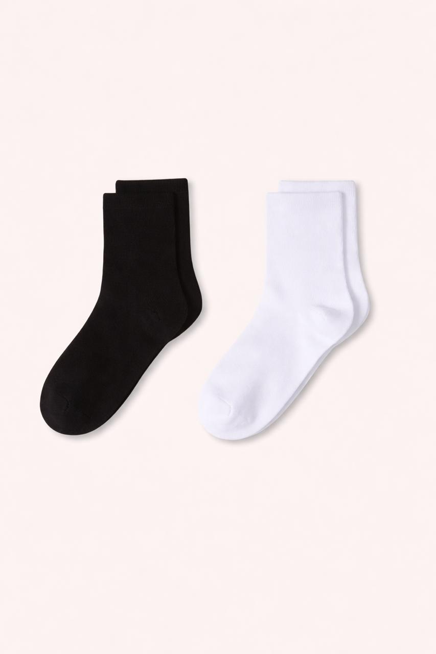 Black and white socks on a light beige background