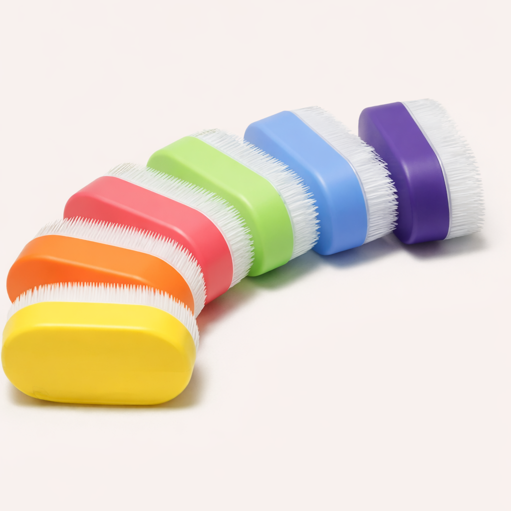 Set of colorful scrub brushes with striped handles on a white background