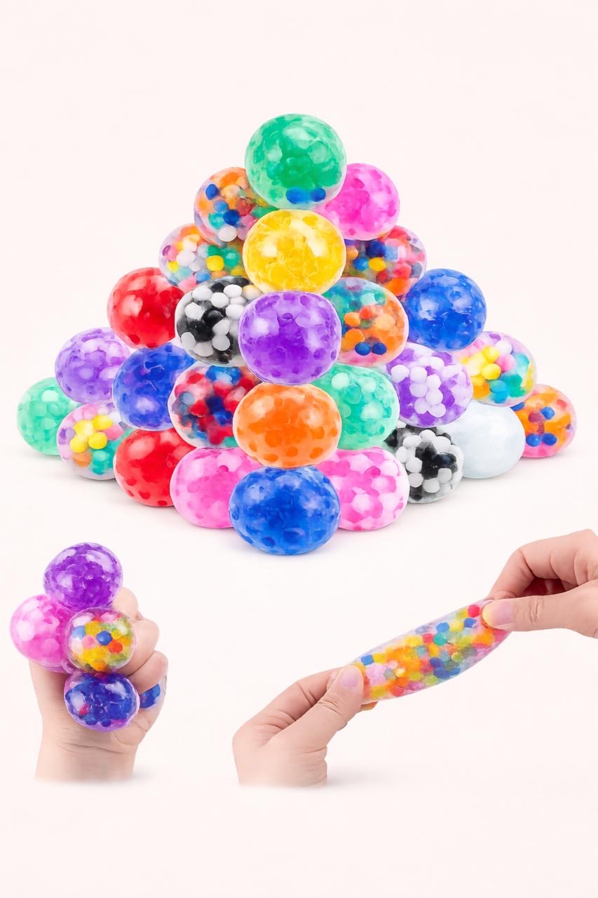 Colorful stress balls arranged in a pyramid shape with a hand holding a colorful bead.